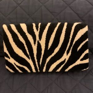 Adorable Arm Candy black and white zebra fold-over flap clutch.
